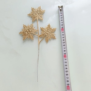 Mesure du pic décoratif flocon de neige doré pour composition florale d'une longueur de 30 cm
