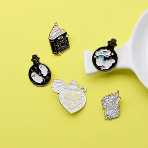 5-piece magical enamel pin set with spell book and ghost potion on yellow background