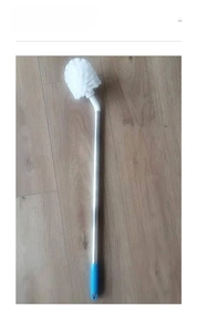 Close-up of long-handle water bottle cleaning brush with spherical white bristles