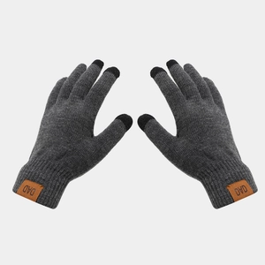 Close-up of dark grey touchscreen knit gloves featuring a brown leather DAD patch detail