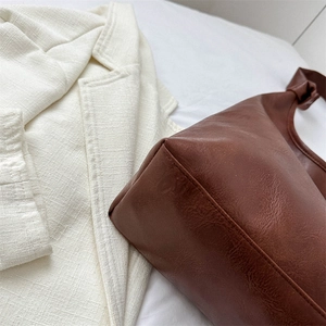 Brown pebbled leather Hobo bucket bag for women with minimalist shoulder strap design