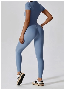 Side view of flexible Morandi blue yoga jumpsuit with zipper and short sleeves