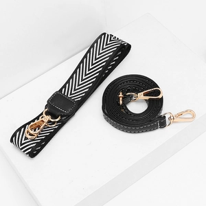 Minimalist crossbody bag with adjustable wide woven strap and narrow leather strap detail