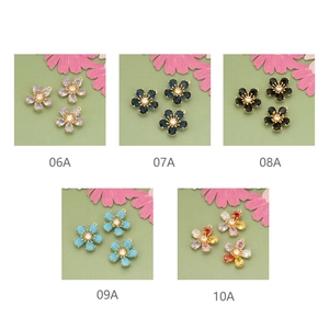 Detailed grid of 18k gold plated five-petal flower pendants in five assorted colors