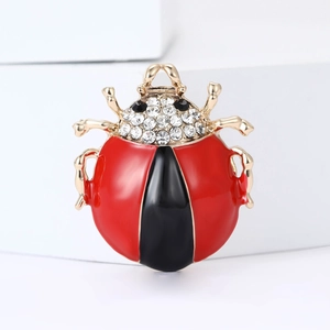 Chic ladybug brooch in red and black enamel with sparkling crystals and gold plating