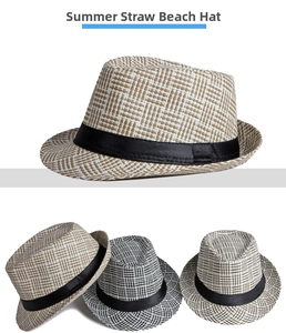 Detail of woven straw fedora hat texture with black satin ribbon for sun protection