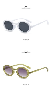 Detail view of round retro punk sunglasses in white and olive green at 45 degree angle
