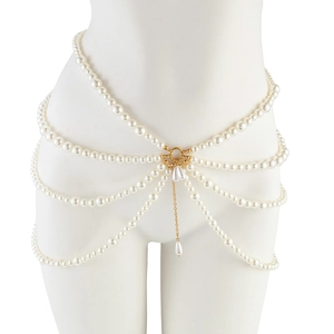Detail of multi-layer faux pearl body chain with golden buckle and drop pendants