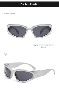 Close-up of silver Y2K futuristic sports sunglasses with sleek silver frames and dark lenses