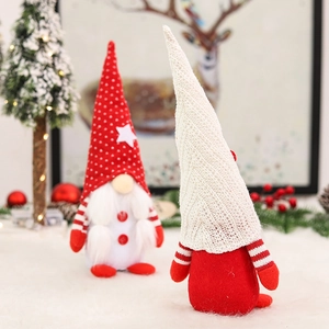 Pair of festive Christmas gnomes with red and white hats for holiday home decoration