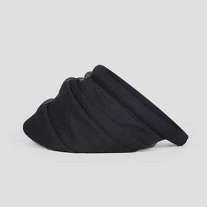 Detail of black organza sun hat featuring multi-layered pleated texture and open-top design