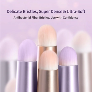 Mini portable round lipstick brush with soft synthetic fibers and a matching metal cap