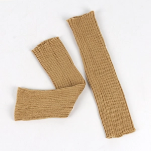 Detail of camel rib-knit leg warmers showing high-quality texture and stitching