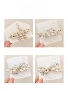 Detailed set of butterfly and starfish hair clips with white pearls and rhinestones