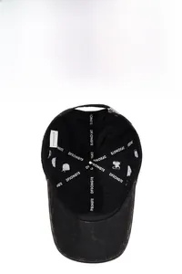 Internal detail of a washed grey baseball cap showing reinforced tape and stitching