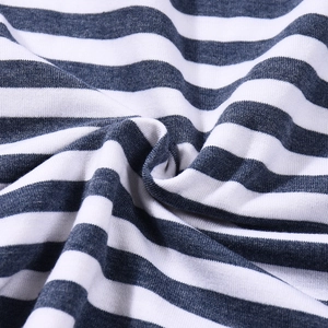 Close-up of blue and white striped knit fabric showing soft texture and vertical ribbing