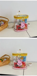 Detail of transparent PVC kids backpack showing interior storage space and pink rabbit charm