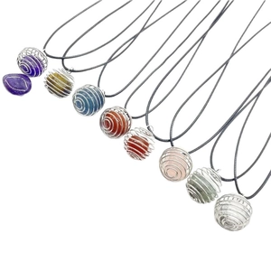Set of nine assorted natural crystal stone necklaces with silver wire cage pendants