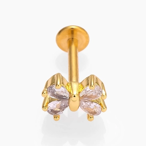 Detailed macro view of a golden butterfly flat back stud featuring four marquise zircons
