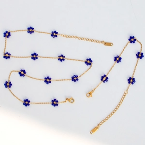 Detail of blue beaded flower necklace with lobster clasp and S.STEEL engraved tag