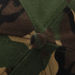 Macro shot of jungle camouflage baseball cap crown with button and six-panel stitching