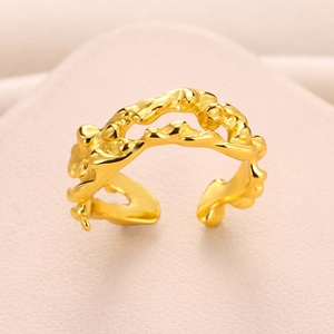 Macro detail of gold-plated water drop ring with irregular molten metal texture design