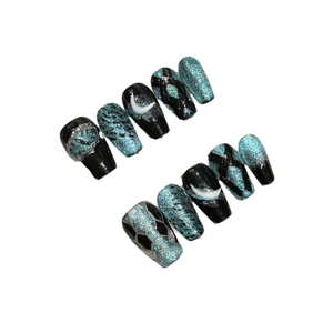 Handmade 3D moon press-on nails with blue-black cat-eye glitter and silver moon art