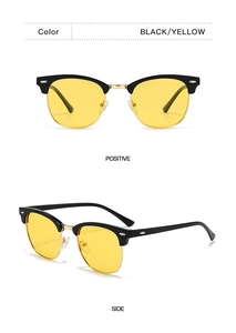 Detail of retro half-frame Clubmaster sunglasses with black frames and yellow lenses