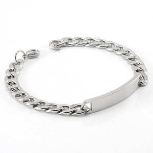 Silver stainless steel cuban link bracelet with rectangular nameplate on white background