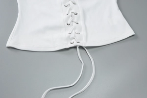 Detailed view of white ribbed knit top featuring adjustable front lace-up drawstring design