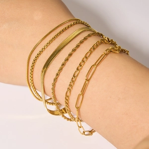 Golden stainless steel chain bracelet set featuring snake, twist, and figaro link styles