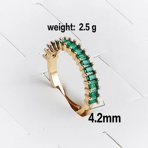Detail view of gold adjustable ring with emerald-green rectangle stones, 4.2mm width