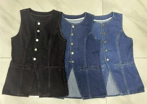 Flat lay detail of sleeveless denim vests in black, dark blue and light blue denim fabric