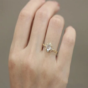 Luxury vintage gold ring with oval cat eye stone and diamonds on woven band