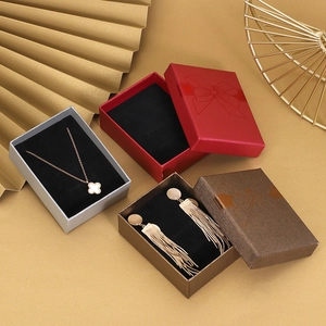 Elegant jewelry gift boxes with bow ribbons in red, grey, and coffee for necklaces