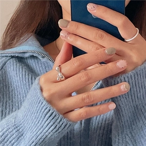 Detail of liquid metal S925 sterling silver drop ring worn on hand for style
