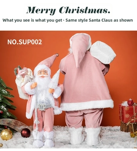 Pink Christmas Santa Claus dolls with white fur trim and silver belt on faux snow scene