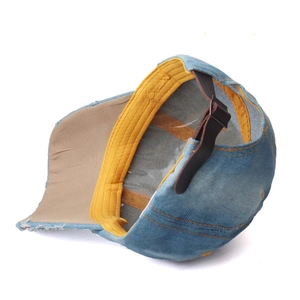 Denim blue baseball cap with sparkling rhinestones and adjustable brown leather strap