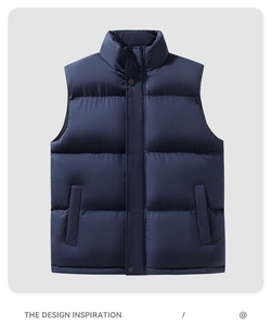 Close-up of dark blue men's quilted puffer vest featuring high stand collar and snap buttons