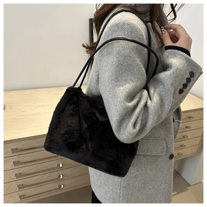 Detail of black faux fur tote bag showing the plush texture and large capacity style