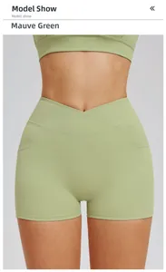 Detail of high waisted crossover yoga shorts in bean green with side pockets