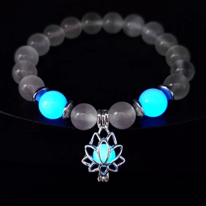 Glow-in-the-dark yoga bracelet with white turquoise beads and a luminous lotus charm