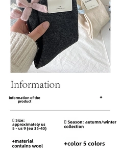Detail of wool knit socks with decorative bows and size specifications for autumn winter