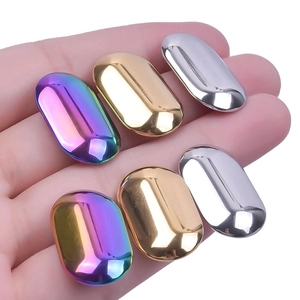 Polished oval stainless steel stud earrings in rainbow, gold, and silver finishes