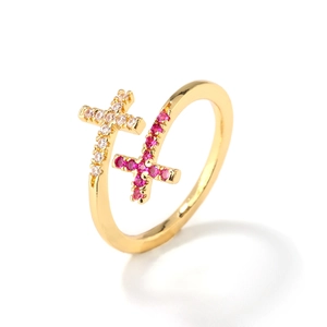 Elegant adjustable cross ring in gold with white and rose red cubic zirconia stones