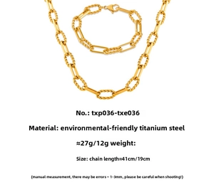 Detail of gold titanium steel jewelry set featuring mixed paperclip and twisted chains