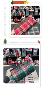 Detail of red and green plaid Christmas wrapping paper with festive Scottish tartan pattern