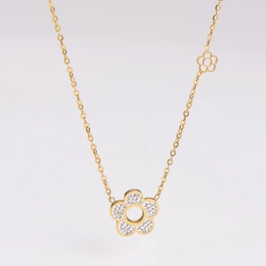 Detailed view of a gold flower necklace with sparkling white rhinestones on white background