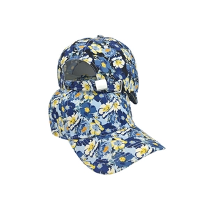 Detail of adjustable metal buckle and blue-yellow floral print on baseball cap
