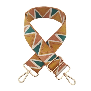 Detail of adjustable bohemian zigzag woven strap with gold metal lobster clasps